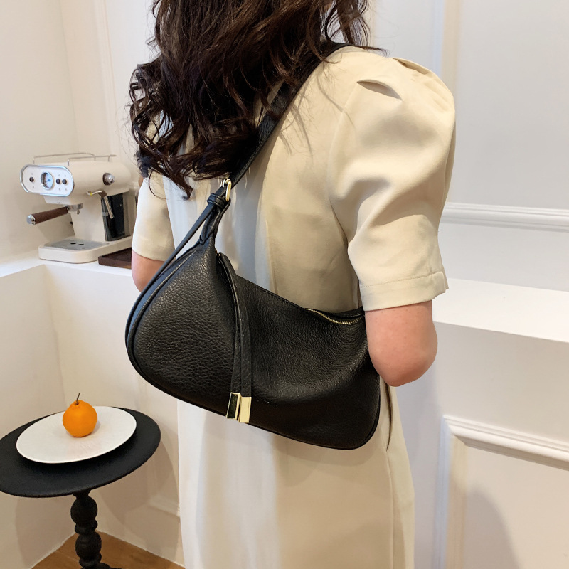 Bolso de hombro cruzado de alta calidad para mujer, nuevo estilo, con patrón de lichi, bolso de moda de nicho, tipo dumpling.