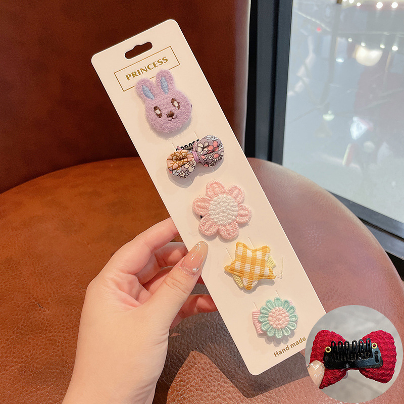 Hermosos clips de cabello de color para niños coreanos de alto nivel sensación de arco de niñas bolsa de tela no daña clips de cabello de bebé