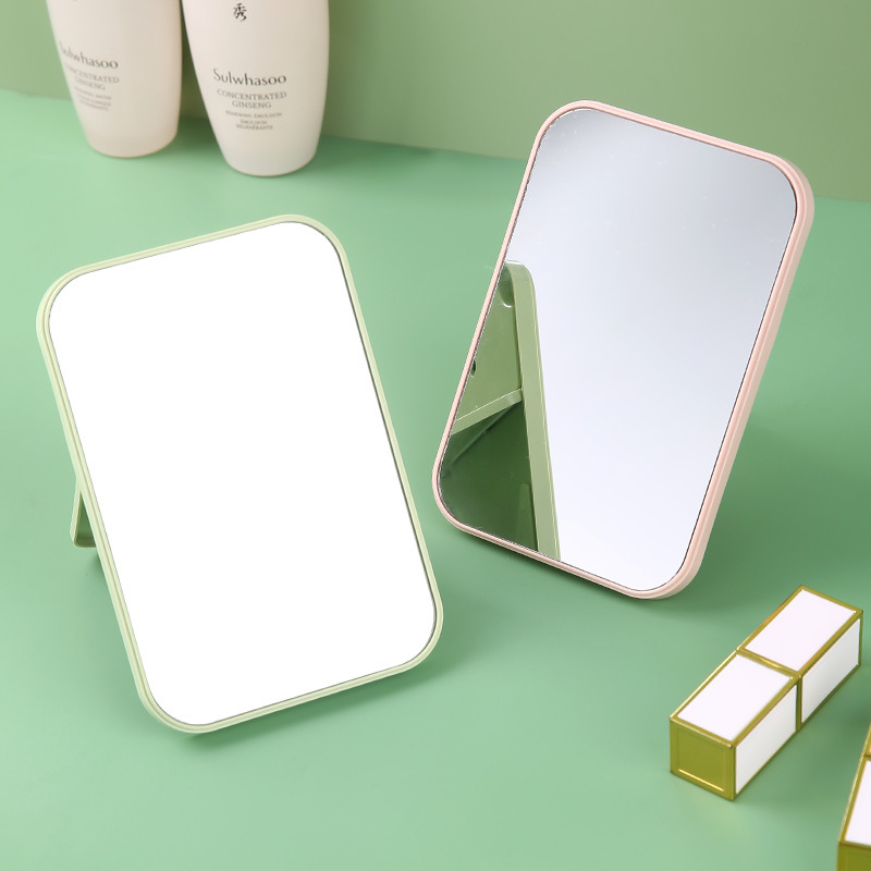 Espejo de maquillaje de plástico para estudiantes, espejo de tocador femenino para escritorio, espejo pequeño para dormitorio, espejo de belleza portátil y plegable.