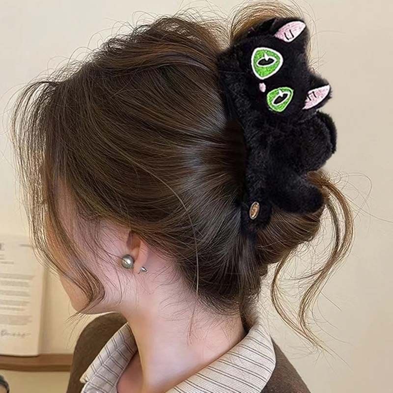 43#Green heterochromatic black plush cat with gold label, approximately 13cm