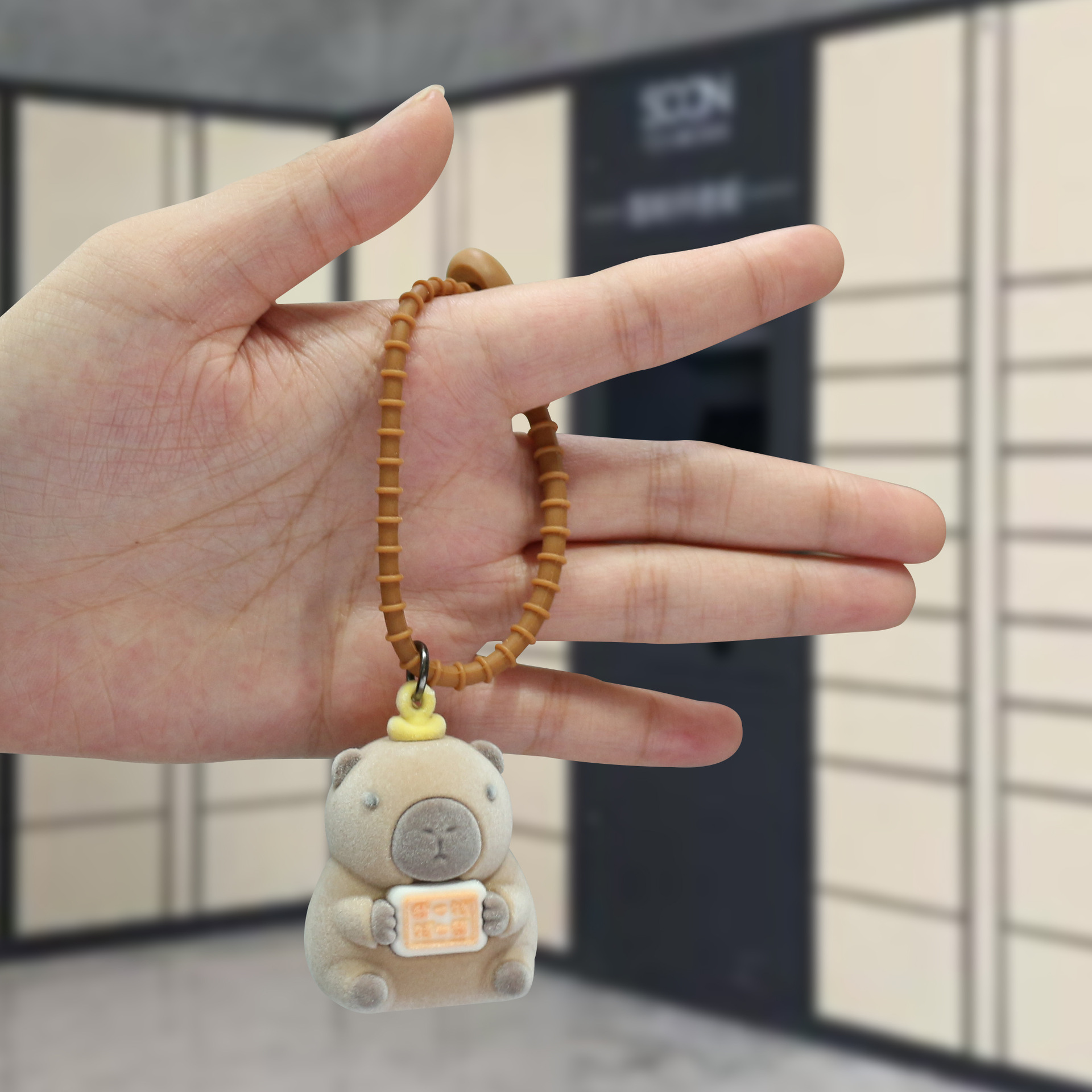 Explosiones transfronterizas flocado nutria llavero de caricatura tridimensional muñeca llavero colgante llavero de bolso