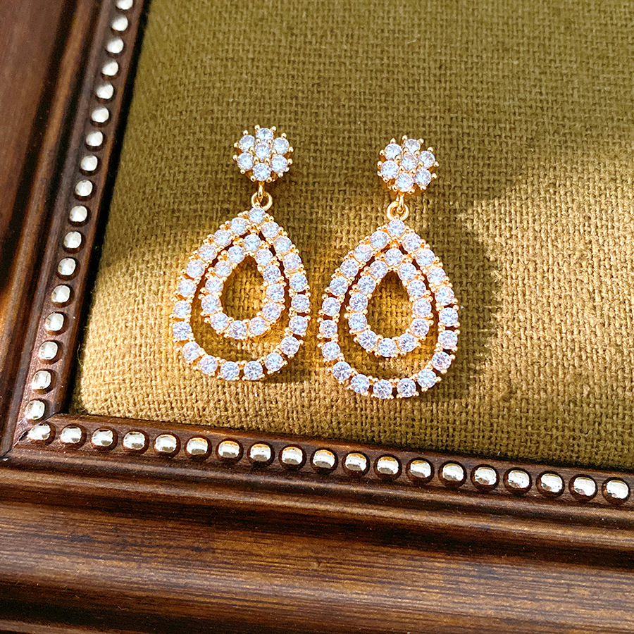 18k oro real chapado aguja de plata de piedra de silicio gota de agua personalidad temperamento pendientes de moda ligero lujo alta sensación de auriculares