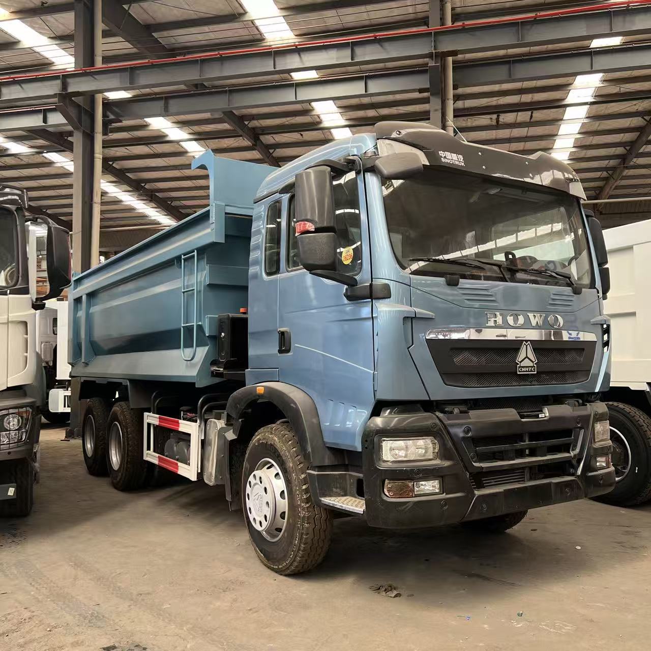China Heavy Duty Truck HOWO TX dump truck, eight-wheel dump truck, mining and gravel engineering transport vehicle, exported to Africa