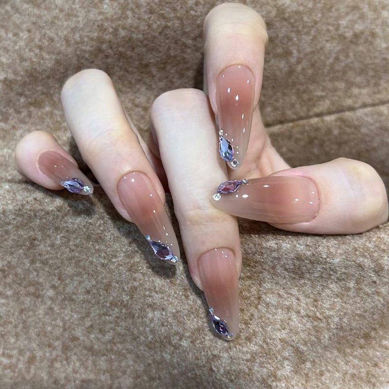 Wearing Almond-Shaped, Luxurious and Elegant Bridal Nail Extensions with Light Therapy, Featuring a Whitening Nude Pink Gradient and a Pure Desire Style Nail Stickers