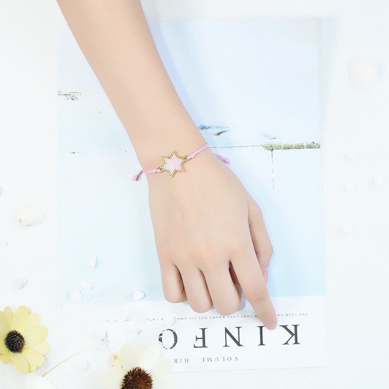Nueva pulsera de las mujeres europeas y americanas importadas granos de arroz DIY hecho a mano original estrella tejida pulsera de la joyería ventas directas de la fábrica