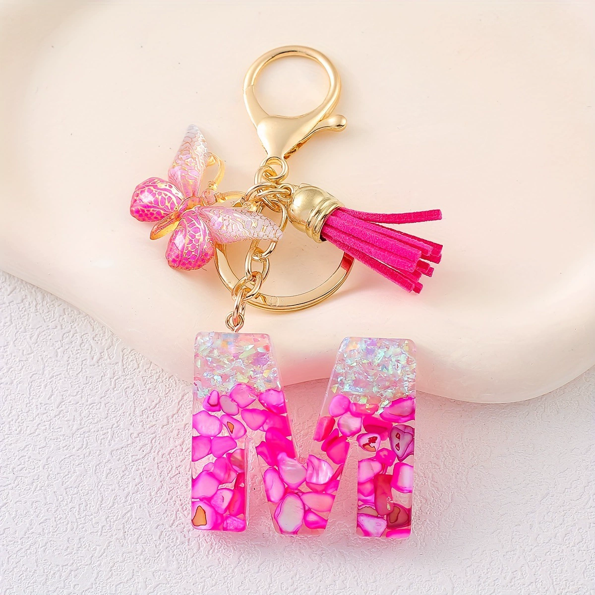 Pink golden keychain with tassels, gradient, with gem