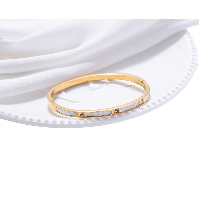 Nueva moda versátil simple brazalete de acero inoxidable de titanio de oro brazalete de diamante de oro brazalete de conchas detalles