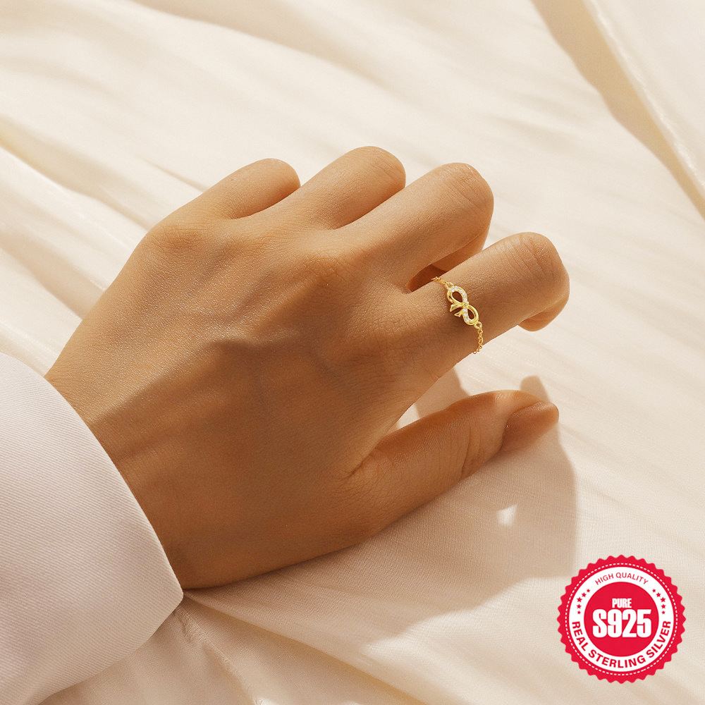 Anillo de circón con incrustaciones de lazo infinito, apertura femenina, anillo de cadena ajustable de lujo ligero plateado S925 de moda europea y americana
