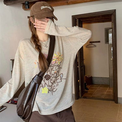 怠惰な風の漫画の落書きの丸首の長袖のtシャツの女性のアルファベットのプリントのデザイン感はゆったりしています。