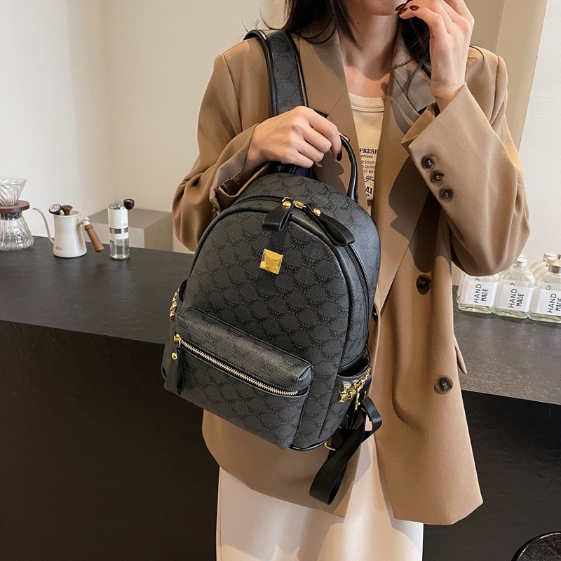 Mochila de estilo universitario de moda para mujeres 2025 nuevo viaje de viaje mochila de estudiantes adorable oso impresión mochila de moda