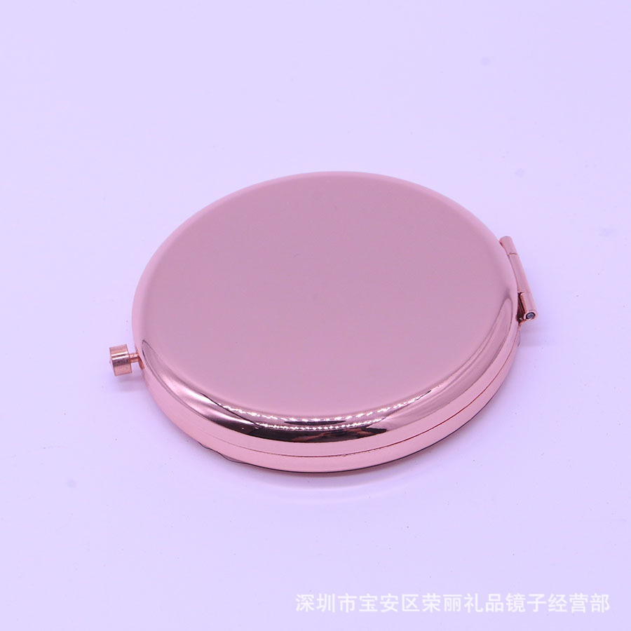 El espejo pequeño de doble luz plegable de metal de alta gama se puede grabar con el logotipo y el espejo de maquillaje portátil de mano al por mayor