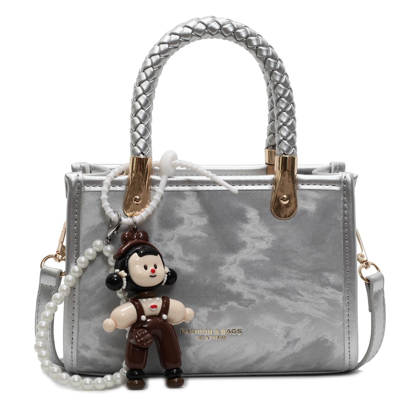 Bolso cuadrado pequeño de mano popular transfronterizo para mujer 2025 nuevo bolso de hombro casual simple bolso de mensajero de moda de alta gama