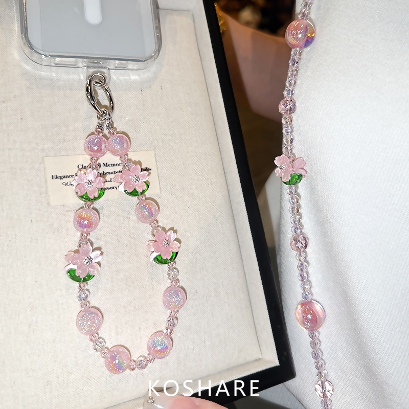 Flor de melocotón brillante cadena de teléfono móvil ligera de lujo de alto nivel colgante de cristal de moda anti-caída colgante de mano perlas para mujeres