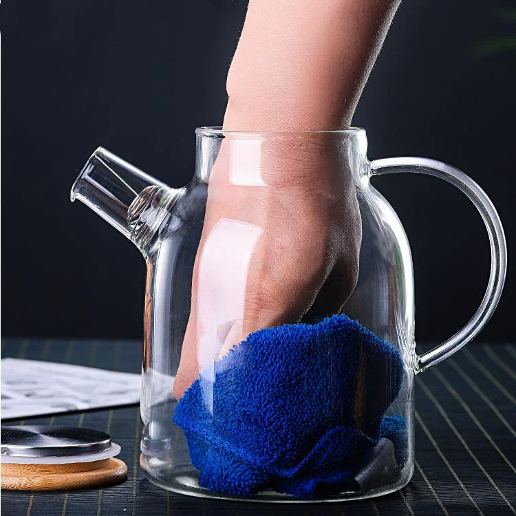 Transparent glass capacious teapot, cooled flavored tea