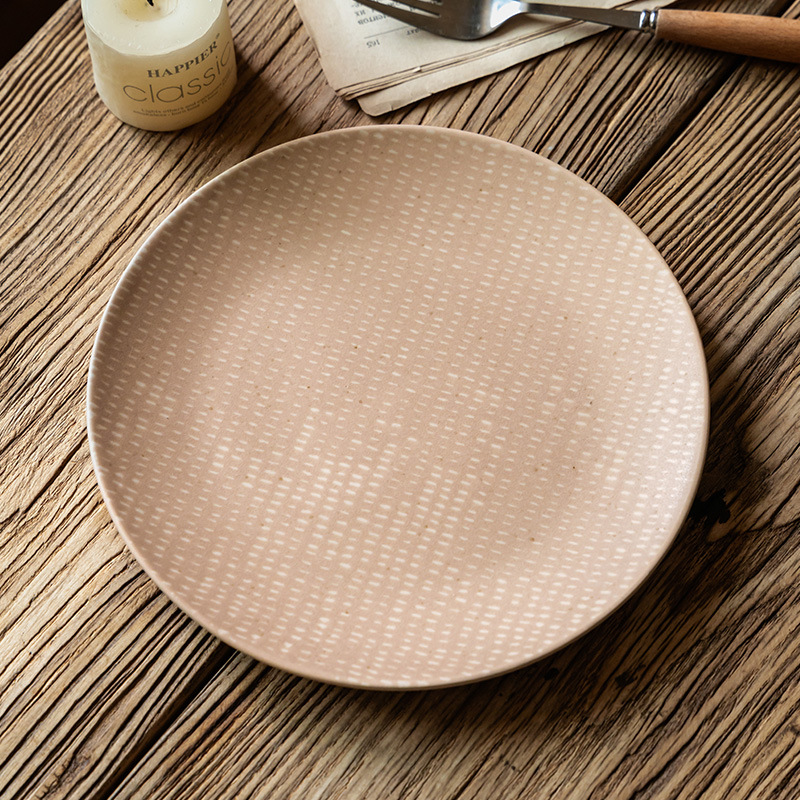 Plato rosa de alto valor de color, plato de postre, plato de cerámica de punto blanco creativo, platos redondos caseros retro, platos de cubiertos al por mayor