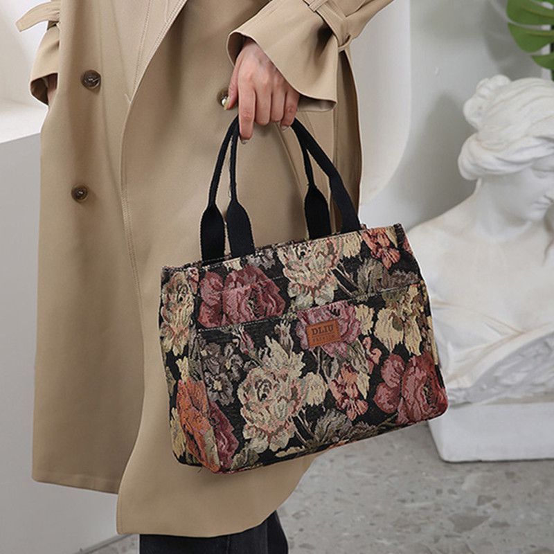 This retro handbag features a tote flower oil painting style. It's convenient to carry a lunch box to work. It has a large capacity and is a mommy bag for going out undefined