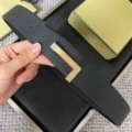 Brushed silver base with gold buckle, black lychee grain strap, 3.8cm wide