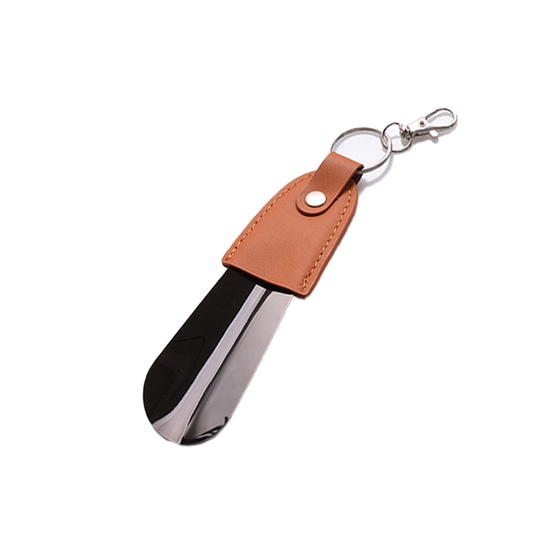 Inventario al por mayor de acero inoxidable llaver de zapato de tirador de cuero funda de zapato portátil de tirador de zapato de coche llave colgante elevador de zapato