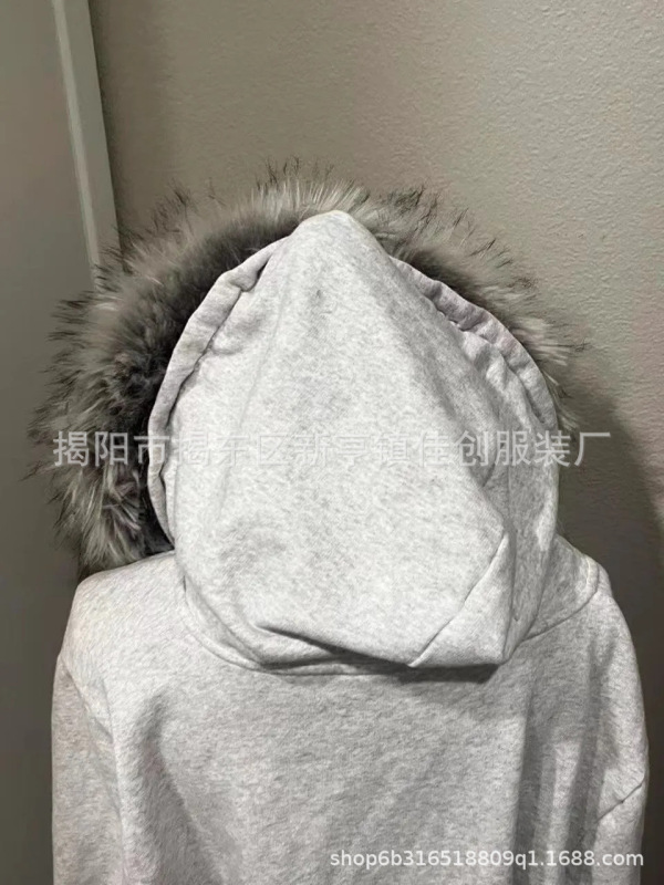 ベルベットのカーディガンのセーターの冬の新しいアメリカのレトロな個性的な街頭のトレンドはフードの男女である|undefined