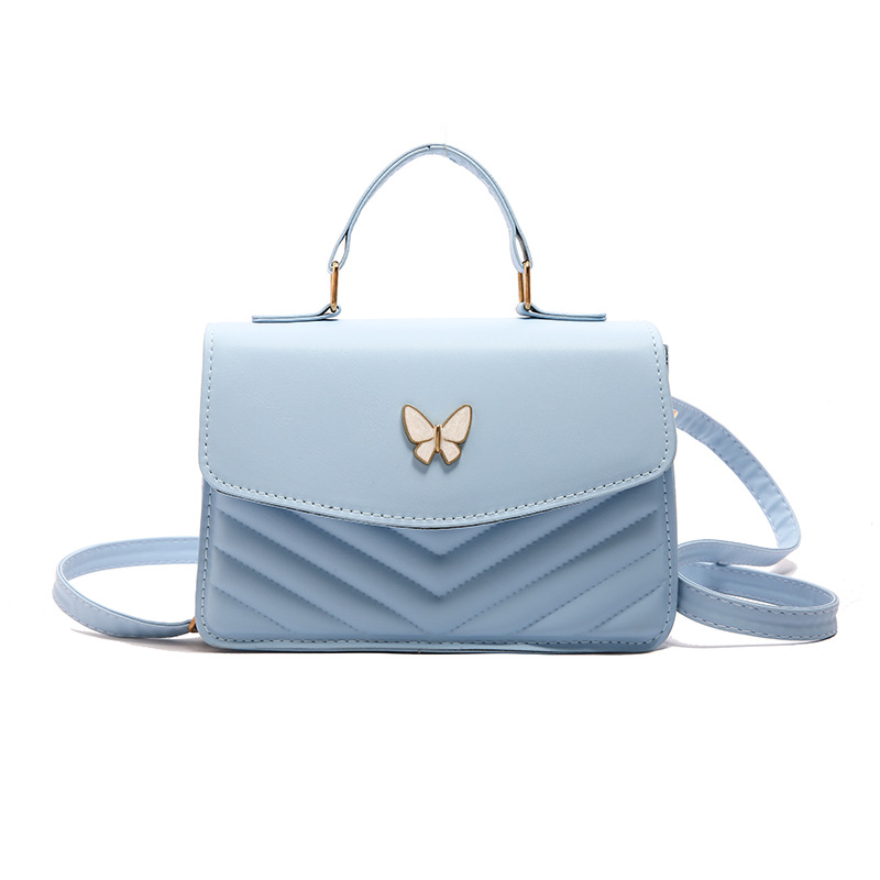 Bolso bordado de color sólido otoño y invierno 2024 nuevo estilo retro bolso de moda simple bolso de mariposa de moda
