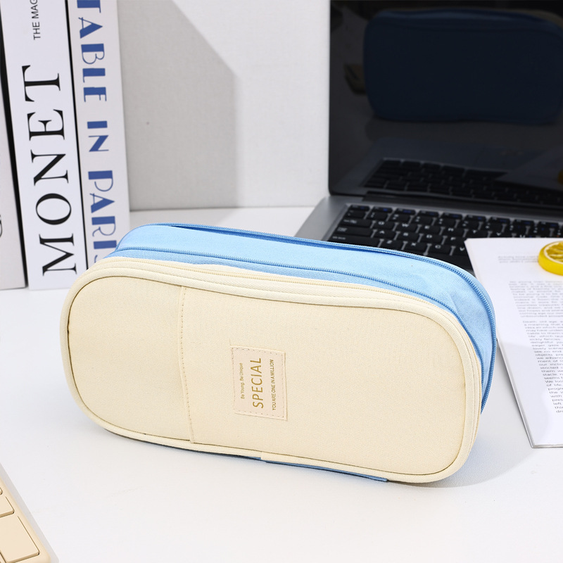 Bolso de lápices retráctil de lona de color de contraste de estilo explosivo transfronterizo Bolso de papelería de gran capacidad con doble cremallera simple multifuncional para estudiantes