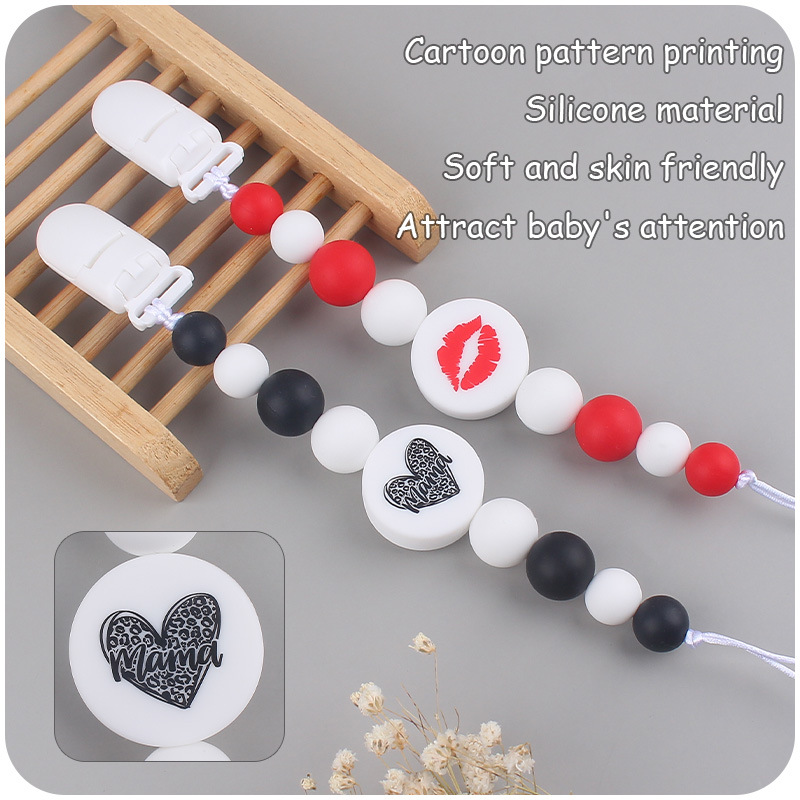 Nuevo bebé suministros de dibujos animados de impresión redonda amor creativo DIY silicona mordedura molar pezón cadena anti-caída