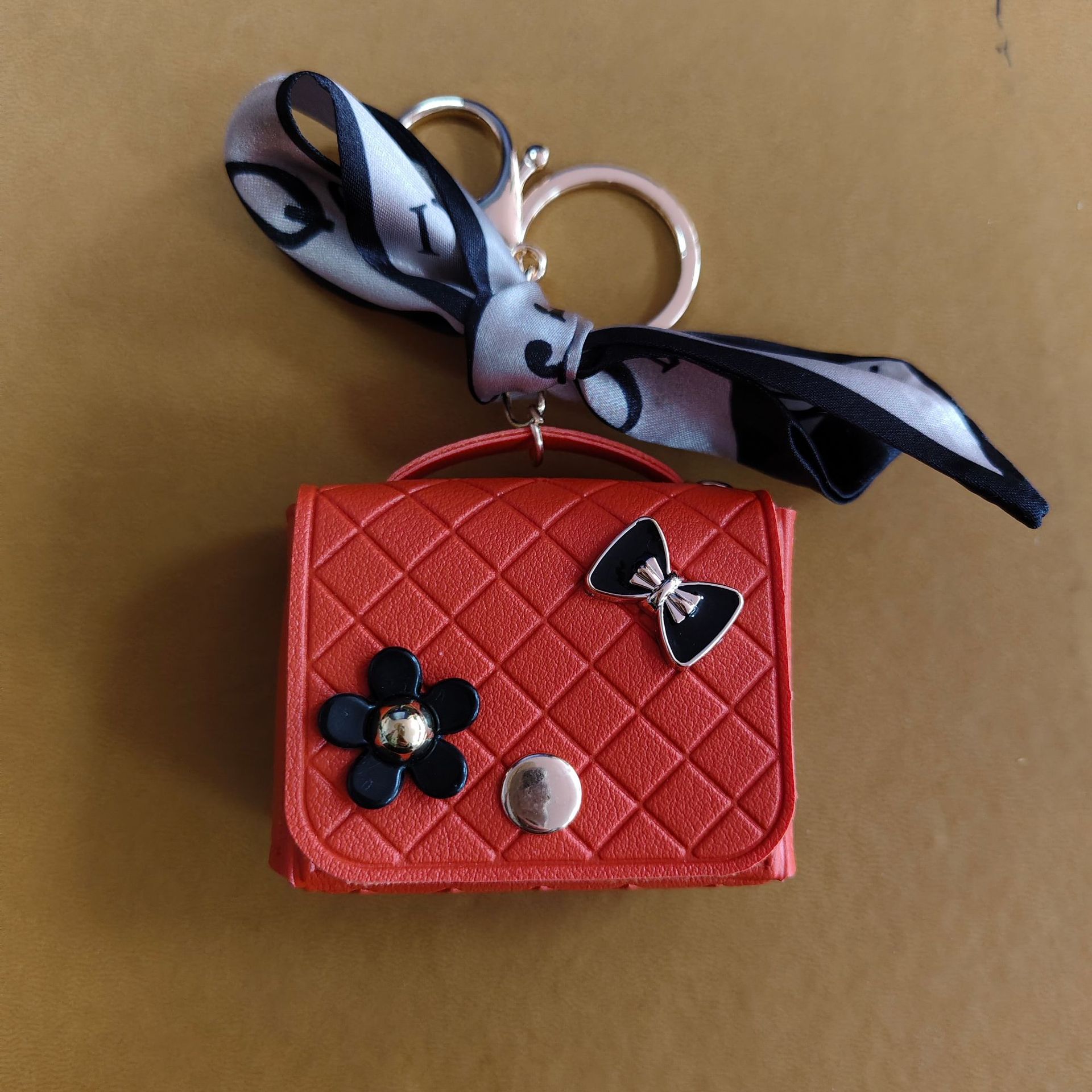 Nuevo estilo transfronterizo, moderno y exclusivo mini bolso acolchado tipo colgante, monedero para llaves, accesorio para auriculares.