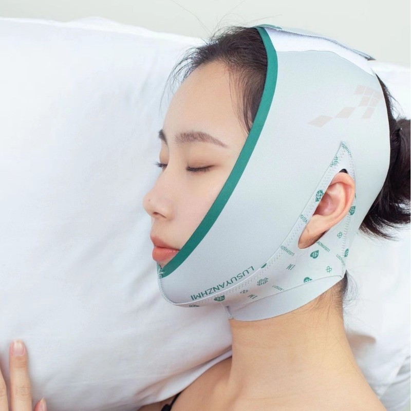小さな顔の形のやせた顔は法令の紋様の睡眠の包帯のマスクの美容院の面の彫刻を持って引き延ばして線の彫刻のやせた顔を結びます。|undefined