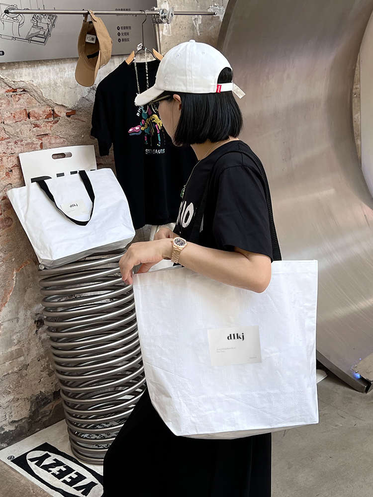 Tienda de ropa bolsa de tejido impresa LOGO ropa de mujer bolsa de compras regalos ropa al por mayor bolsa personalizada