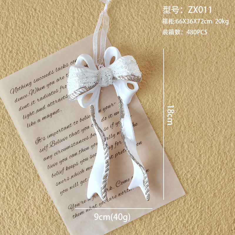 Nuevo colgante de acrílico de Navidad blanco transfronterizo, copos de nieve en polvo de brillo, paquete de regalo de árbol de Navidad de mariposa, colgante de caramelo pequeño