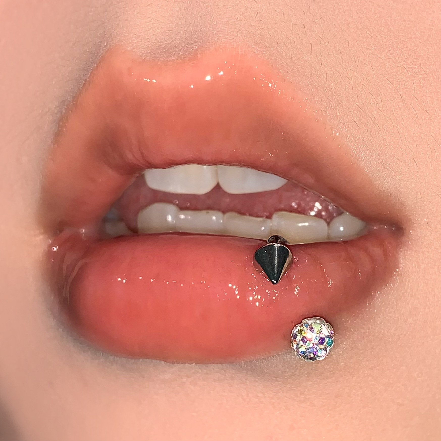 Silver pointed spike labret stud material detail