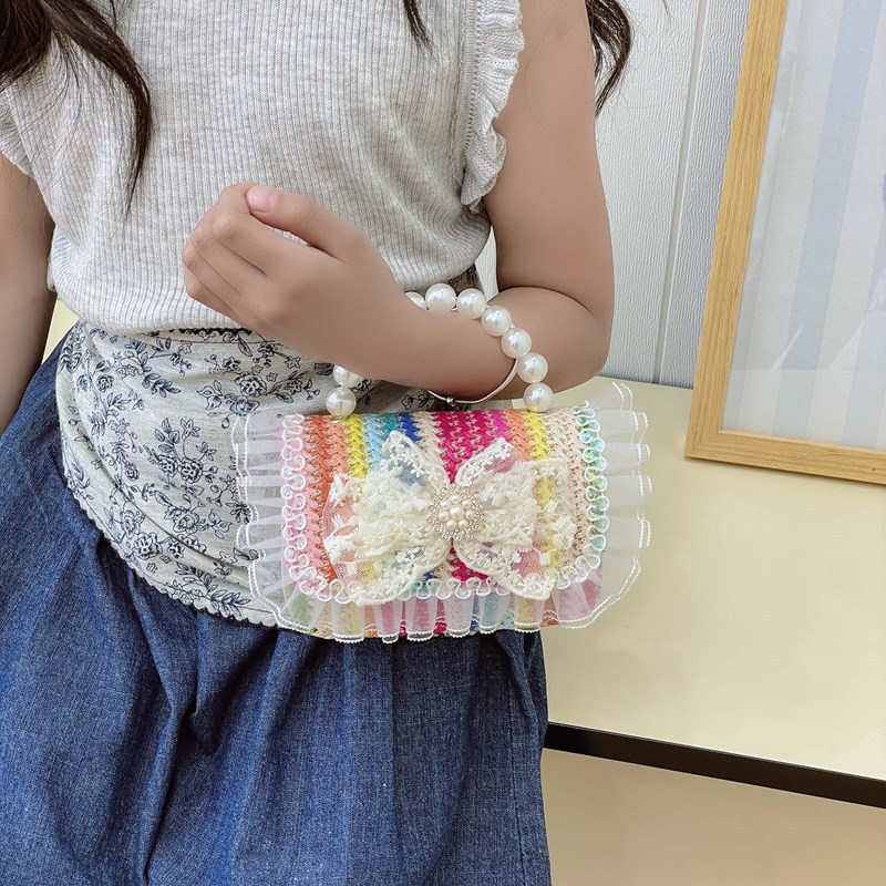 2025 nuevo regalo para niñas para niñas jardín de infantes Día de los niños arco de perla tela de paja bolso de hombro