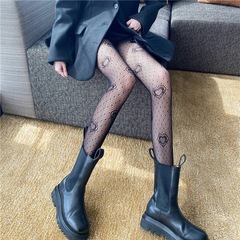 Black fishnet stockings with hollow-out, hot-fix rhinestone detailing—sexy JK-style mesh pants featuring lettering. Plus-size, alluring European and American-inspired design with an Instagram-worthy bow and delicate butterfly motif on these fishnet socks.
