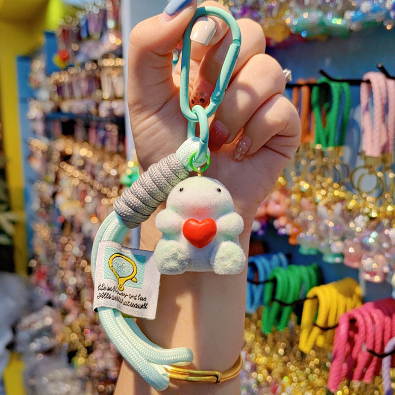 Nuevo caricatura flocado amor Godzilla llavero de moda pareja llavero bolsos de mujer accesorios colgantes de teléfono móvil joyas