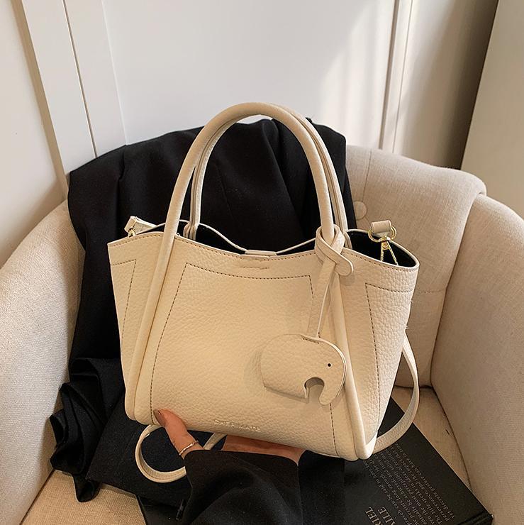 Tendencia transfronteriza de moda canasta de platos de mano 2025 nuevo nicho de alta sensación bolso de hombro bolso de cubo universal para mujeres