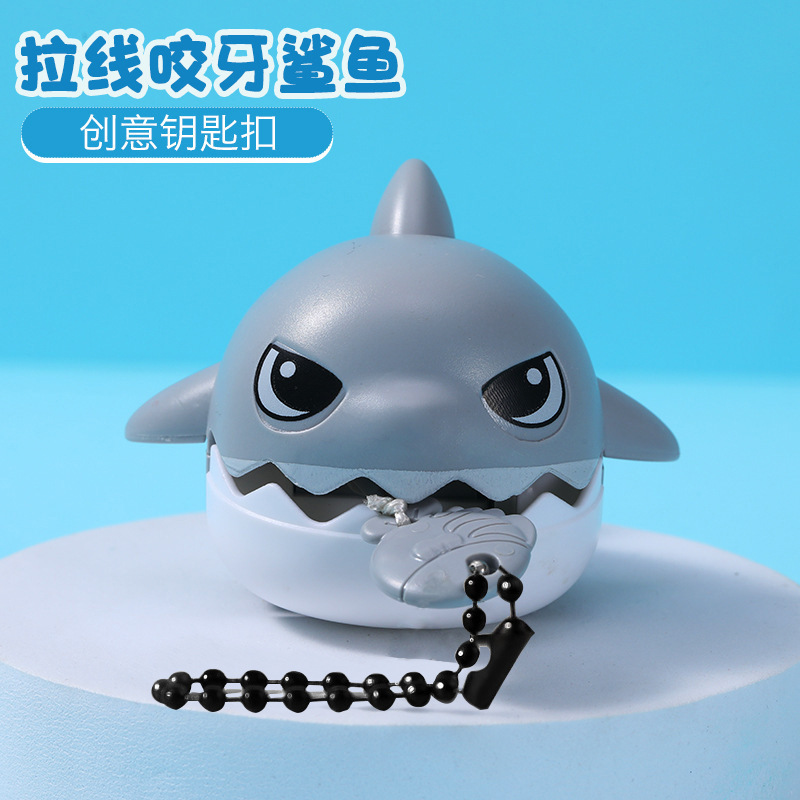 Tirar de los dientes, morderse los dientes, colgante de tiburón pequeño, tirar de la cuerda, artefacto de descompresión, pez grande, comer peces pequeños, llavero creativo, juguete para niños