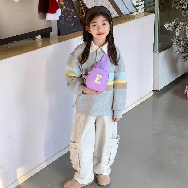 Coreana moda cool bolso de pecho para niños y niñas simple bolso de bebé de color sólido 2026 nuevo bolso de letras para niños
