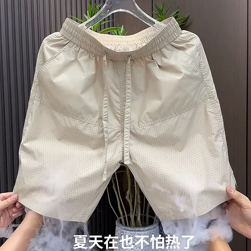 Pantalones cortos deportivos finos de verano, pantalones casuales de cinco puntos de malla de color sólido para hombres, pantalones de playa sueltos transpirables, de moda