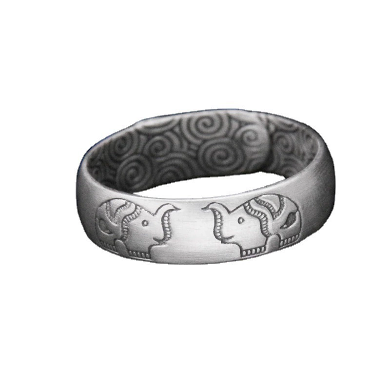 Silver bracelet, retro design ring, on index finger