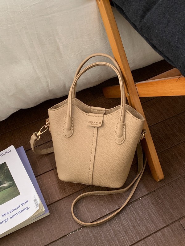 Bolso de mano de moda retro 2026 nuevo temperamento simple bolso de cubo de viaje ocio mochila de hombro