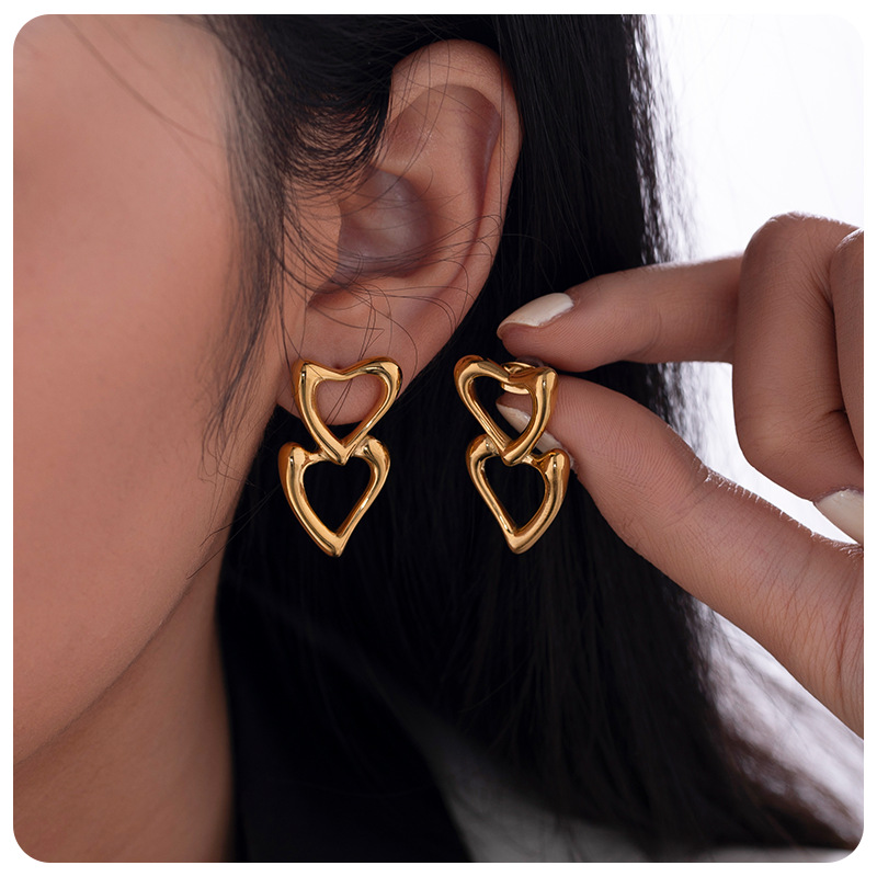 TENA nicho de amor amor amor hueco pendientes de acero inoxidable chapado en oro 18 quilates doble goteo de zircón pendientes de aceite