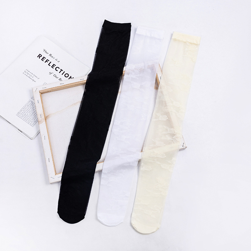 Calcetines por encima de la rodilla de las mujeres ins medias de flores grandes delgadas transparentes estilo JK medias blancas y negras atractivas del color sólido al por mayor