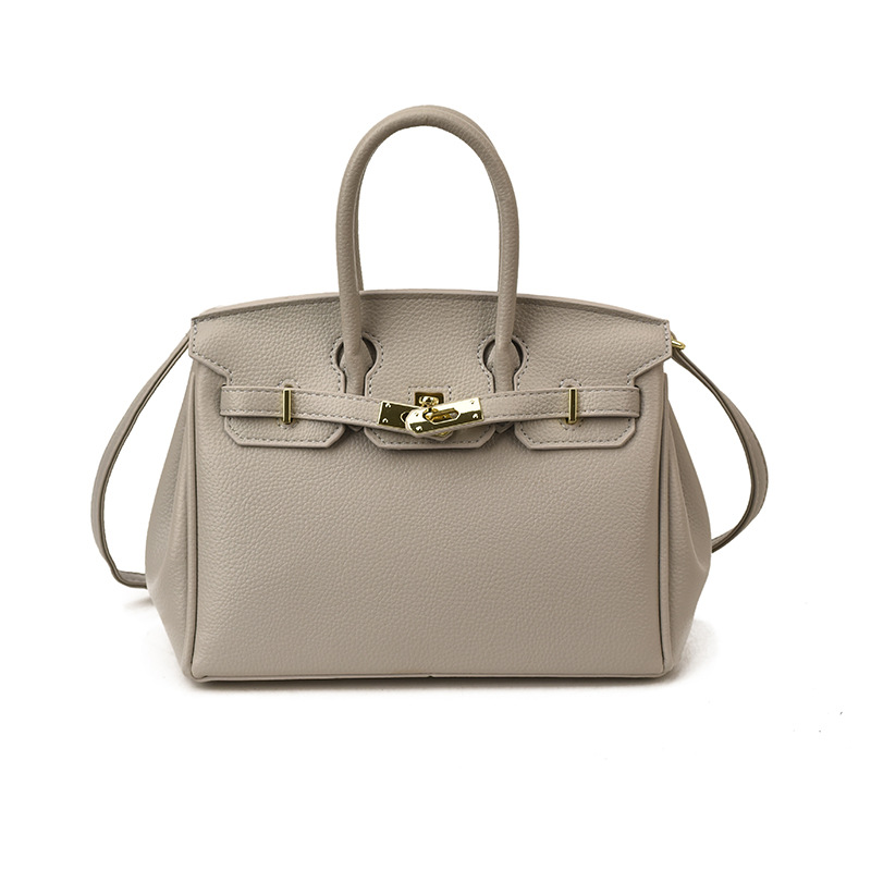 Bolsos de platino retro retro de alta calidad para mujeres 2026 comercio exterior nueva moda litchi pattern commuter mochila versátil