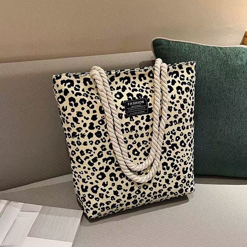 Bolso de mujer 2026 nueva impresión bolso de lona de moda leopardo coreano bolso de gran capacidad bolso de hombro de mano de compras