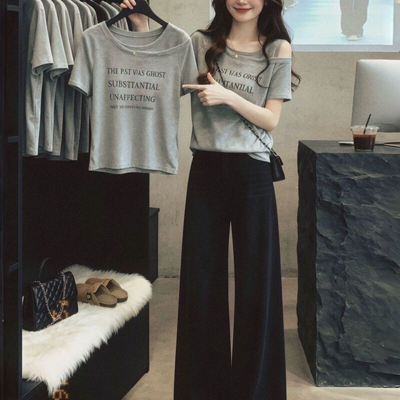 Korean Style Fake Two-Piece Letter Print Short-Sleeve T-Shirt for Women, Summer 2026 New Model, Slimming Design for Slightly Plump Women, Off-Shoulder Top Korean Style Fake Two-Piece Letter Print Short-Sleeve T-Shirt for Women, Summer 2026 New Model, Slimming Design for Slightly Plump Women, Off-Shoulder Top