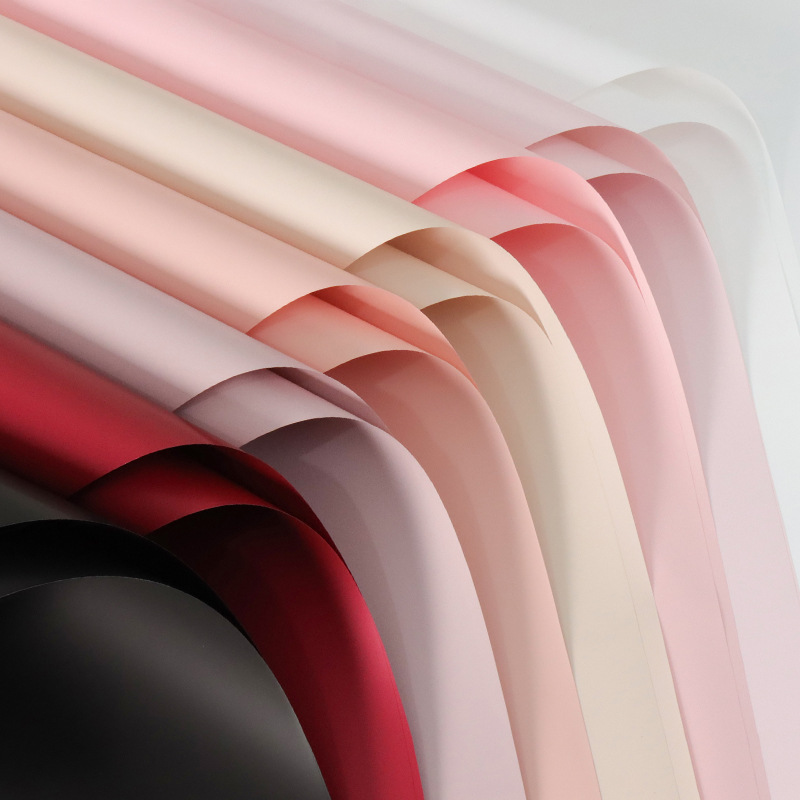 Deca papel de embalaje de flores de color sólido en stock al por mayor papel ouya impermeable material de la tienda de flores papel de embalaje material de bricolaje