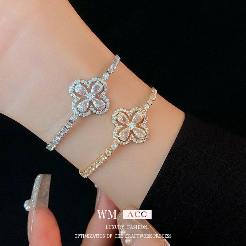 Oro real electrochapado ZIRCON flor hebilla pulsera moda todo-fósforo pulsera luz lujo alto sentido pulsera para las mujeres al por mayor