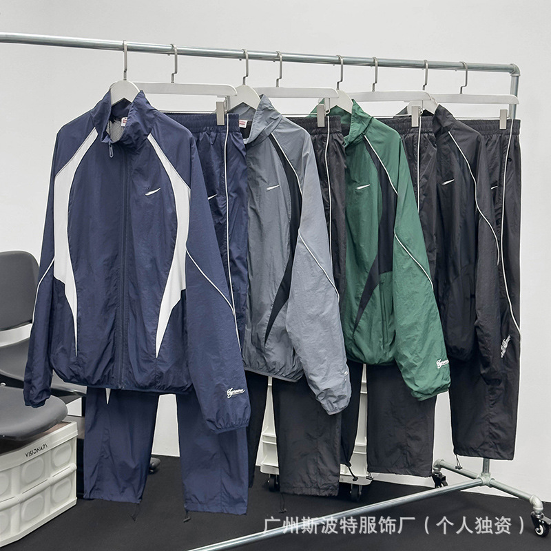 Cross-Border Wholesale Nk Spring and Autumn Set with Embroidered Logo, Reflective Color-Blocking, Casual Couple's Sports Running Windbreaker Cross-Border Wholesale Nk Spring and Autumn Set with Embroidered Logo, Reflective Color-Blocking, Casual Couple's Sports Running Windbreaker
