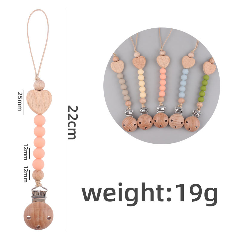 Nuevos suministros para bebés Beech clip anti-gota cadena calmante bebé cuentas de silicona mordida Beech corazón chupete cadena