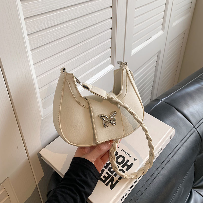 Bolsos de nicho populares para mujer 2024 invierno nueva cadena de moda simple bolso de hombro casual coreano bolso de luna nueva para mujer